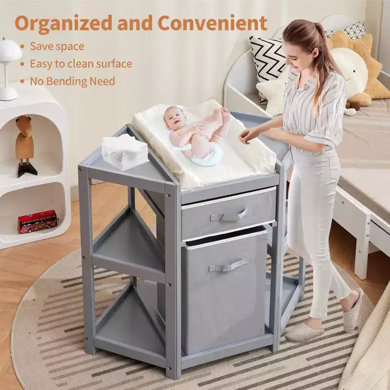 Table à langer d'angle compacte avec tiroir de rangement, panier à linge et matelas imperméable, meuble à langer moderne en bois pour chambre d'enfant, gris